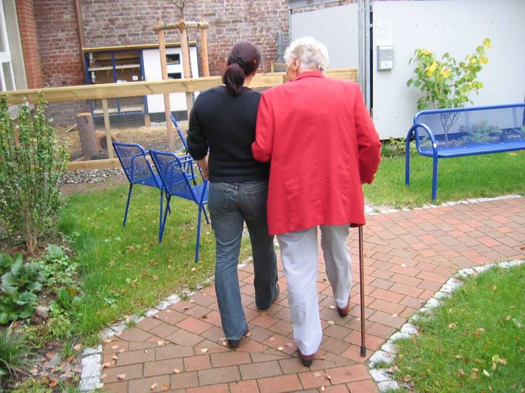 resident and staff walking