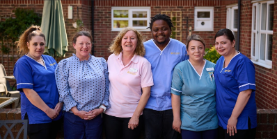 group photo of all the staff outside the care home