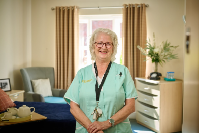 nurse in care home bedroom