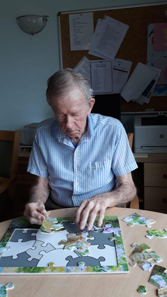 respite care patient doing puzzle