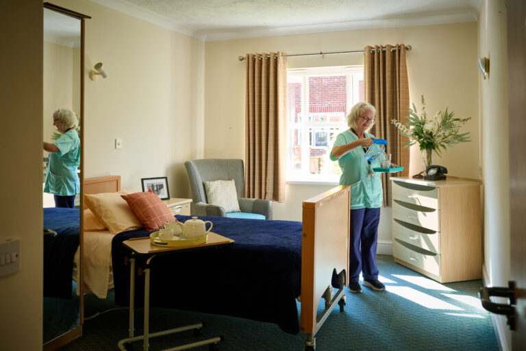 nurse in a residents bedroom