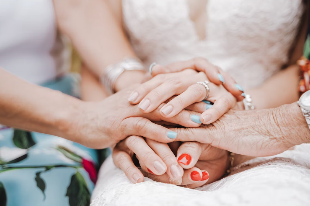 Older ladies holding hands